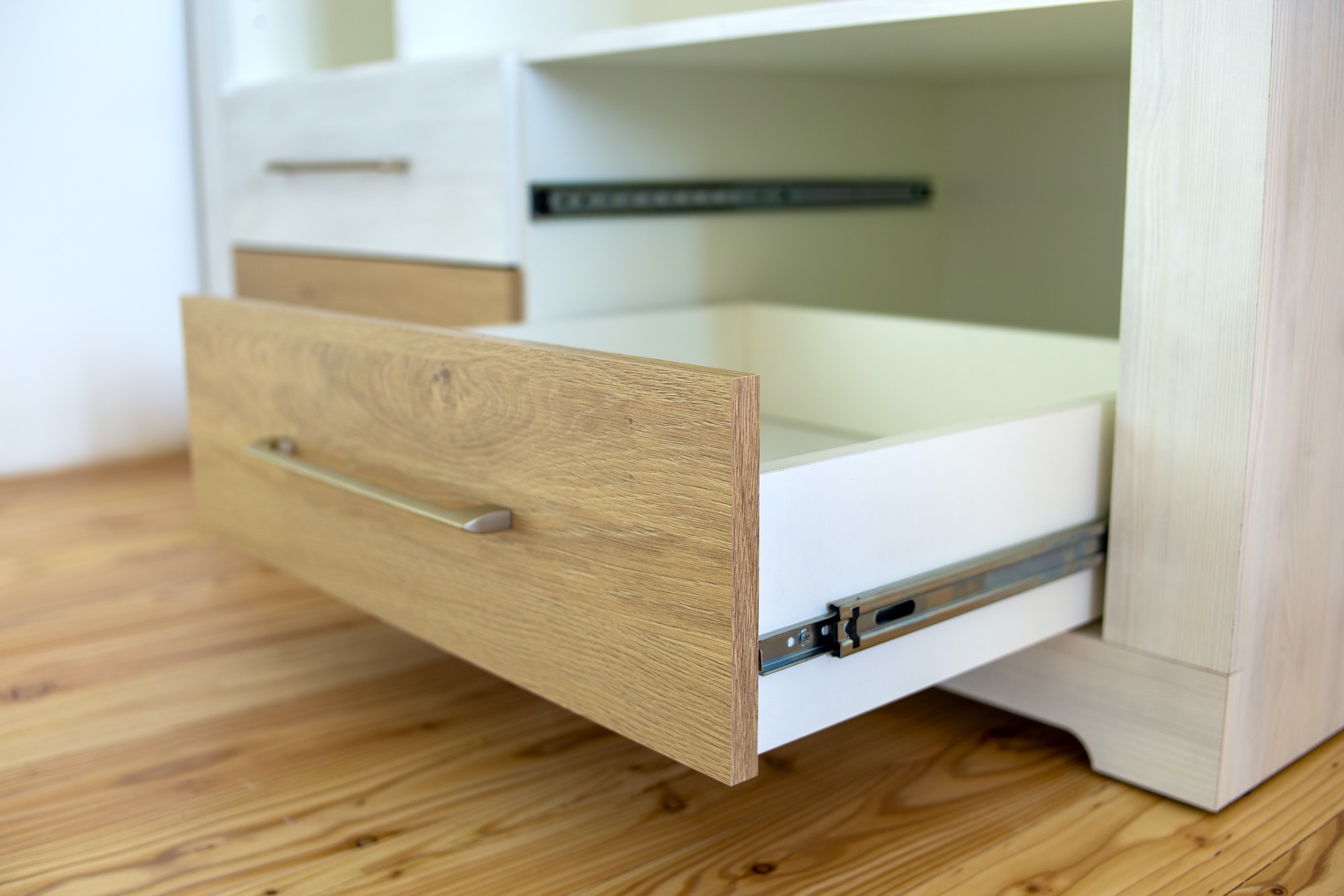 Close up of wooden drawer in contemporary cupboard cabinet